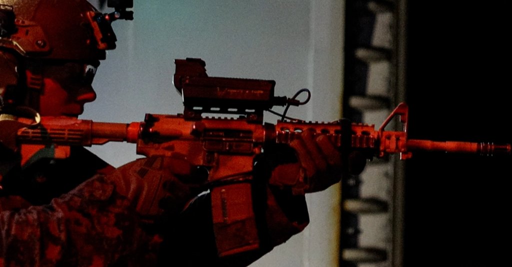 Lance Cpl. Ford Small prepares to fire an M4 carbine fitted with a smart shooter optic during a live-fire training event with the SMASH 2000 L fire control system