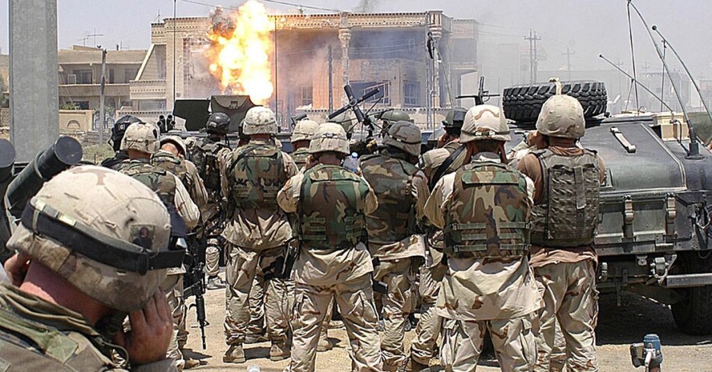 Flame erupts from a building hit with a TOW missile launched by soldiers of the Army's 101st Airborne Division (Air Assault) in Mosul, Iraq. Saddam Hussein's sons Uday and Qusay were killed in the battle as they resisted Coalition forces. (U.S. Army/Spc. Robert Woodward)