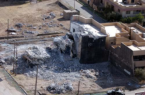 A view from a UH-60 Blackhawk helicopter shows all that's left of the Uday and Qusay house in Mosul, Iraq, July 31, 2003, after Iraqi engineers were hired by the 101st Airborne Division (Air Assault) to demolish the building