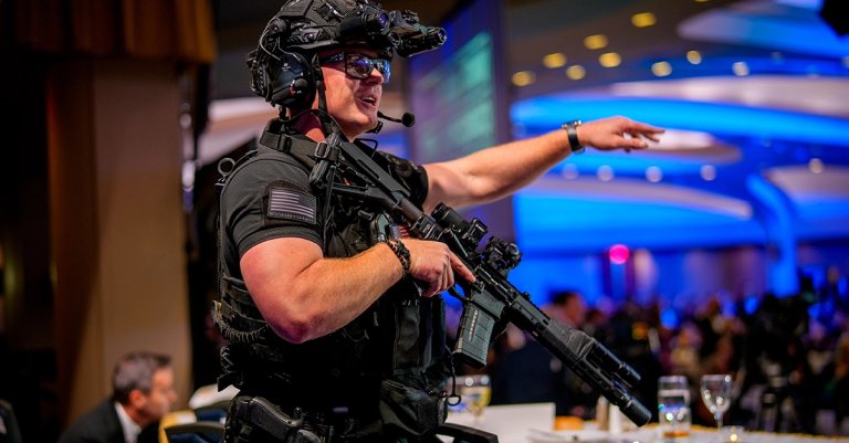 Armed Secret Service agents stand on stage during a shooting incident at the annual White House Correspondents Association Dinner at the Washington Hilton on April 25, 2026 in Washington, DC. According to reports, President Donald Trump, along with other government officials, were evacuated from the Washington Hilton after gun shots. (Photo by Andrew Harnik/Getty Images)