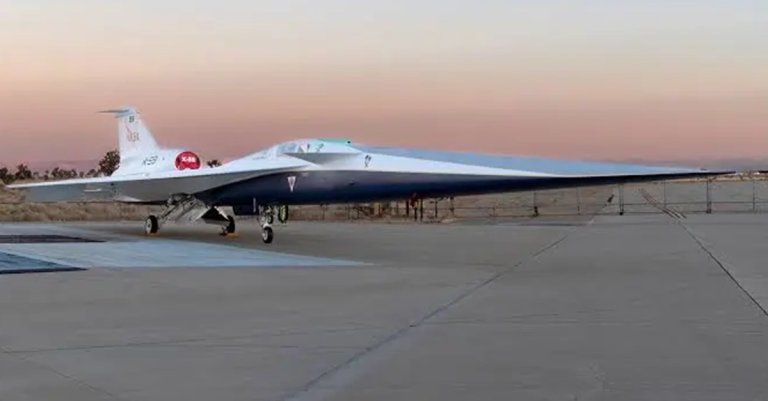 NASA’s X-59 quiet supersonic research aircraft sits on the ramp at Lockheed Martin Skunk Works in Palmdale, California during sunrise, shortly after completion of painting. With its unique design, including a 38-foot-long nose, the X-59 was built to demonstrate the ability to fly supersonic, or faster than the speed of sound, while reducing the typically loud sonic boom produced by aircraft at such speeds to a quieter sonic “thump”. The X-59 is the centerpiece of NASA’s Quesst mission, which seeks to solve one of the major barriers to supersonic flight over land, currently banned in the United States, by making sonic booms quieter.