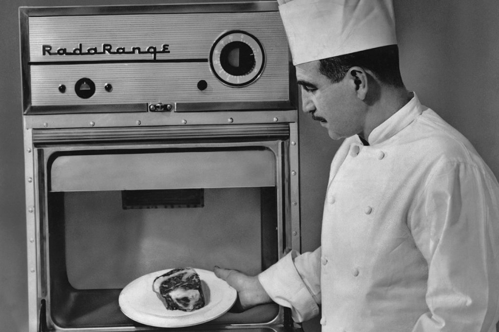 Chef puts food into a RadaRange
