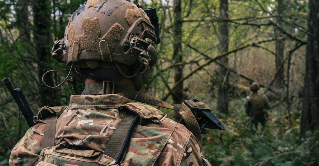 Green Berets assigned to 1st Special Forces Group (Airborne) navigate through dense vegetation on their way to an objective during a simulated ambush attack