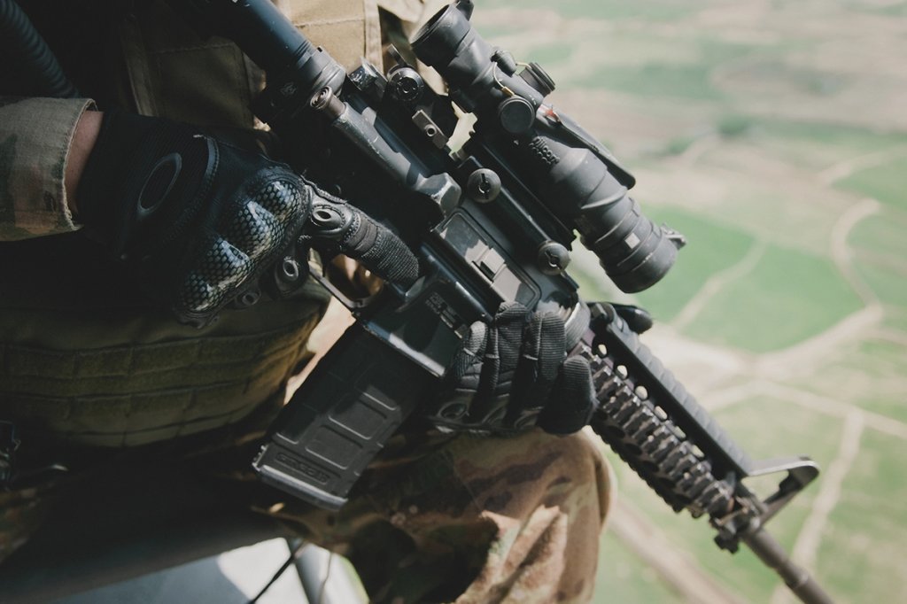 An M4 with 5.56mm rounds rifle sits ready in the hands of a 1st Infantry Division soldier during a mission in eastern Afghanistan. (U.S. Army/Sgt. Roland Hale)