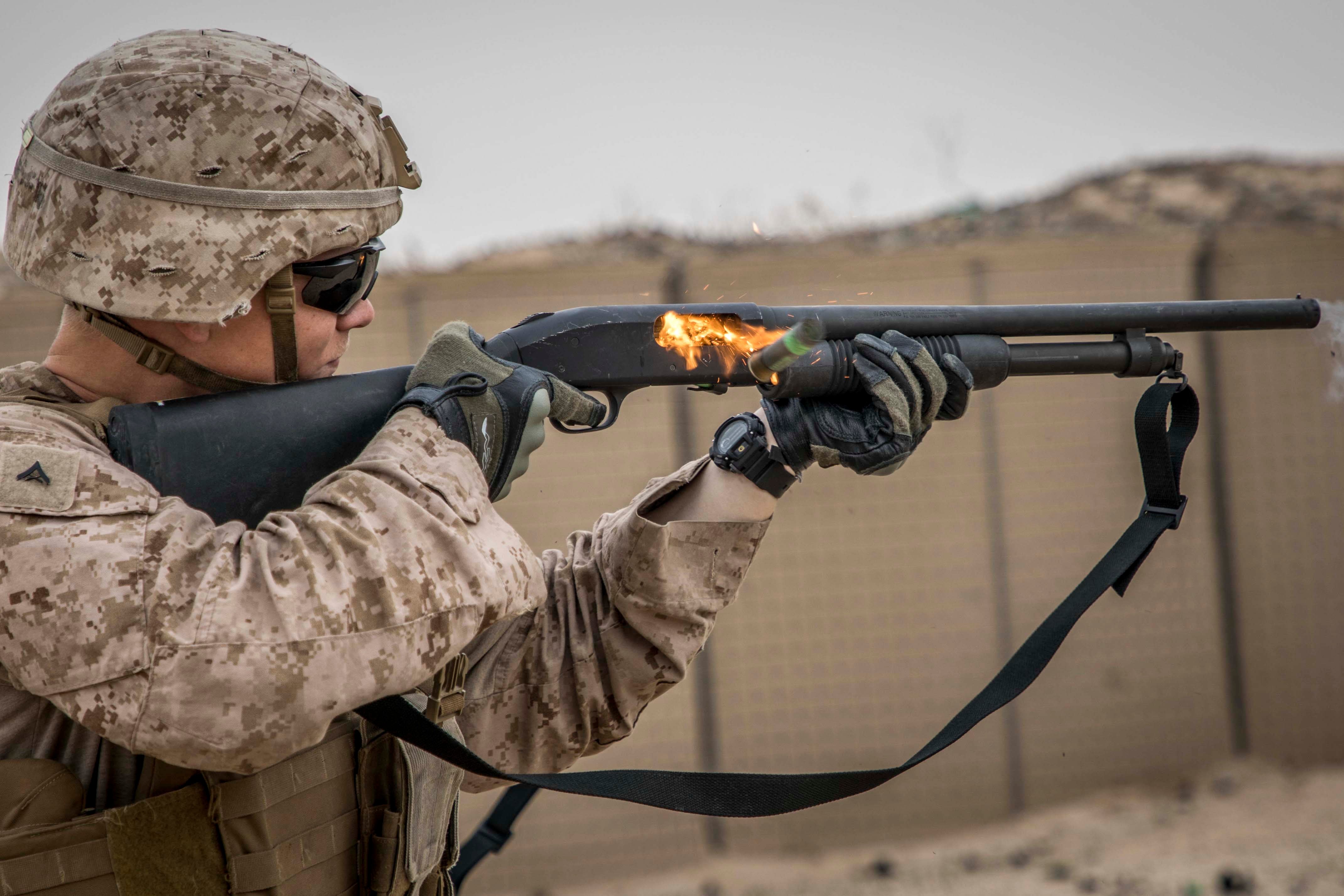 CMP m14 A U.S. Marine with 2nd Battalion, 7th Marines, assigned to Special Purpose Marine Air-Ground Task Force – Crisis Response – Central Command (SPMAGTF-CR-CC) 19.2, fires a Mossberg 590A1 12-gauge shotgun during a non-lethal weapons training exercise, Jan. 18, 2020. The SPMAGTF-CR-CC is a multiple force provider designed to employ ground, logistics and air capabilities throughout the Central Command area of responsibility. (U.S. Marine Corps photo by Sgt. Branden J. Bourque)