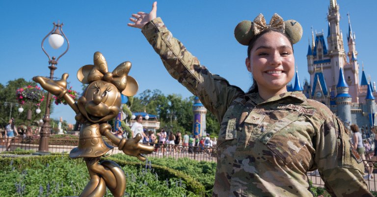 U.S. Air Force Senior Airman Leandra Garcia, 33rd Fighter Wing public affairs specialist, poses next to a statue of Minnie Mouse at Walt Disney World Resort, Florida, July 3, 2023. Garcia documented a celebratory flyover over Cinderella Castle on July 4, 2023. The flyover involved a KC-135 Stratotanker assigned to the 6th Air Refueling Wing and multiple F-35A Lightning IIs assigned to the 33rd Fighter Wing. The flyover was conducted in celebration of the Fourth of July and highlighted the 100th anniversary of the Walt Disney Company and of air refueling, a capability that enables global reach for the Air Force. (U.S. Air Force photo by Senior Airman Joshua Hastings)