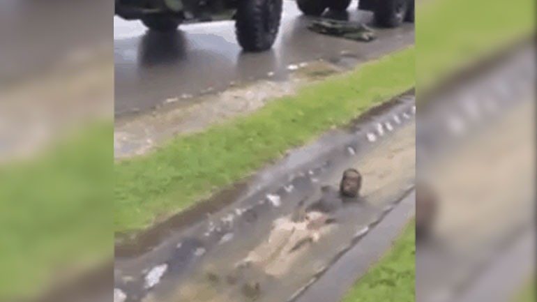 Marines improvise an awesome waterslide during a rain storm