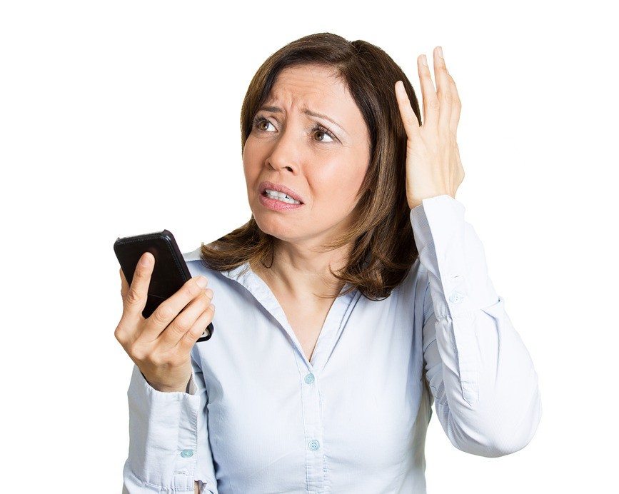 Stock image of woman holding phone. JSOC tracked phones of insurgents, which worked well.