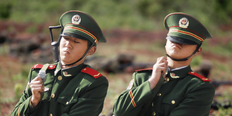 Troops struggling with their uniform