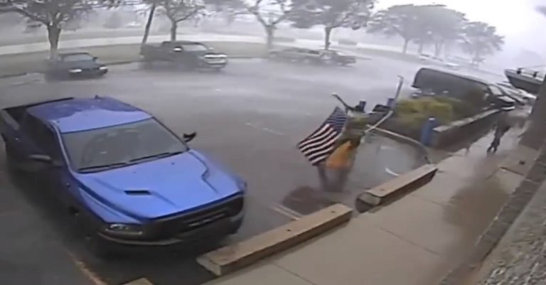 Watch as these soldiers rush into a storm to pick up a fallen flag