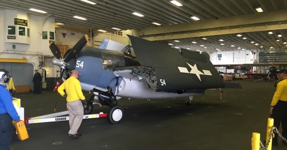 This modern amphibious assault ship is carrying WWII planes